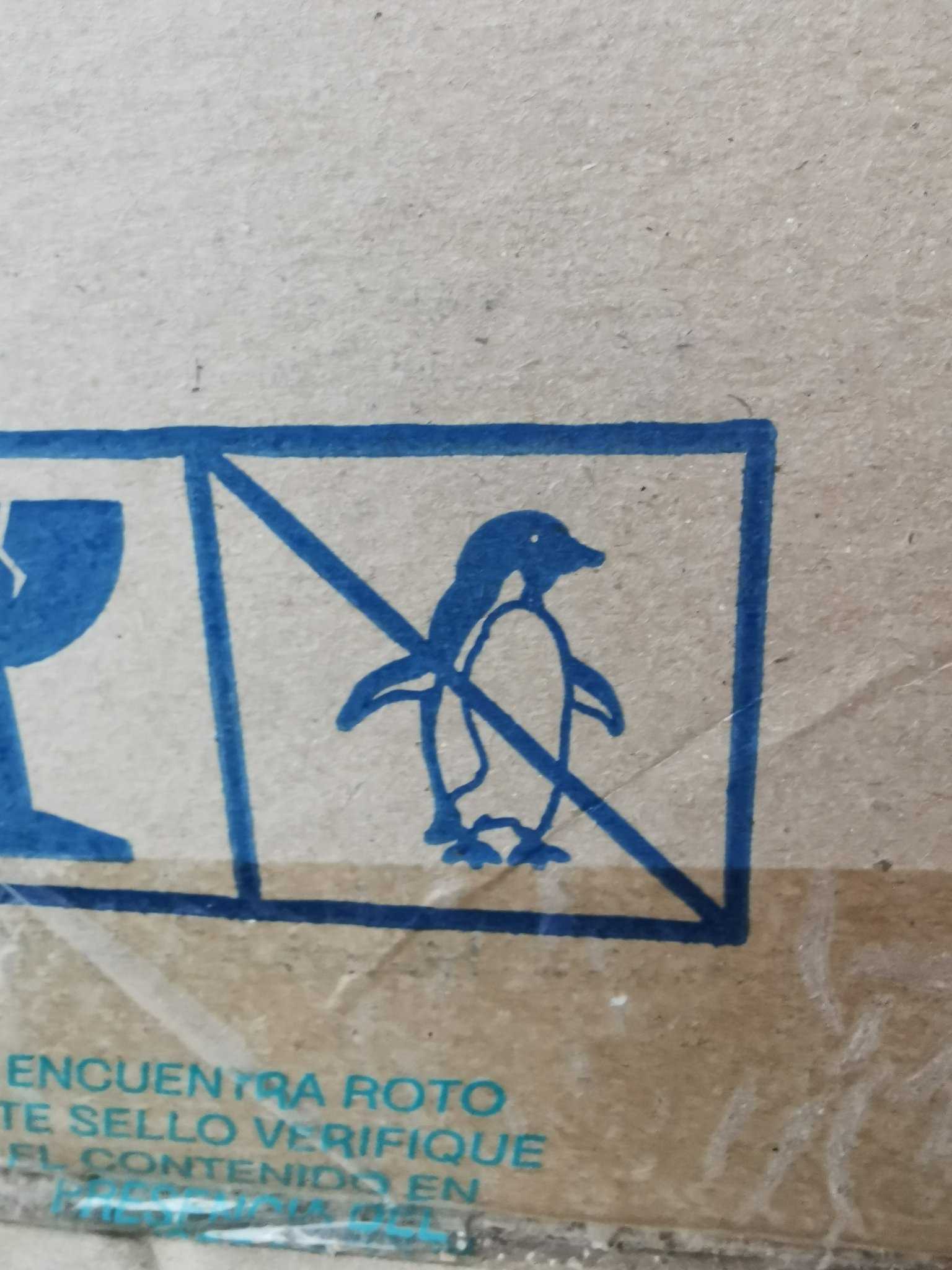 there is a box with a penguin on it and a toilet in it