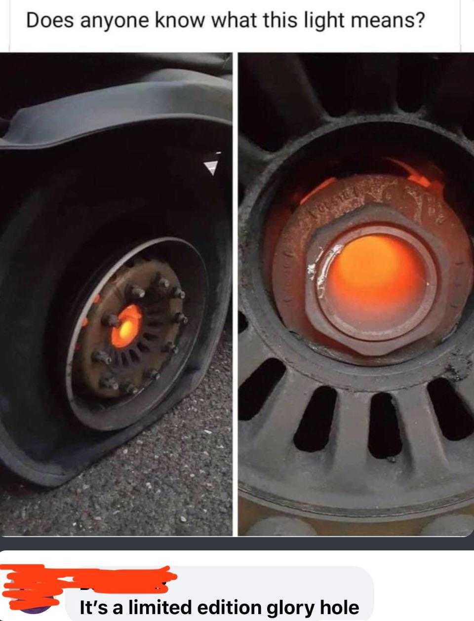 a close up of a tire with a red light on it