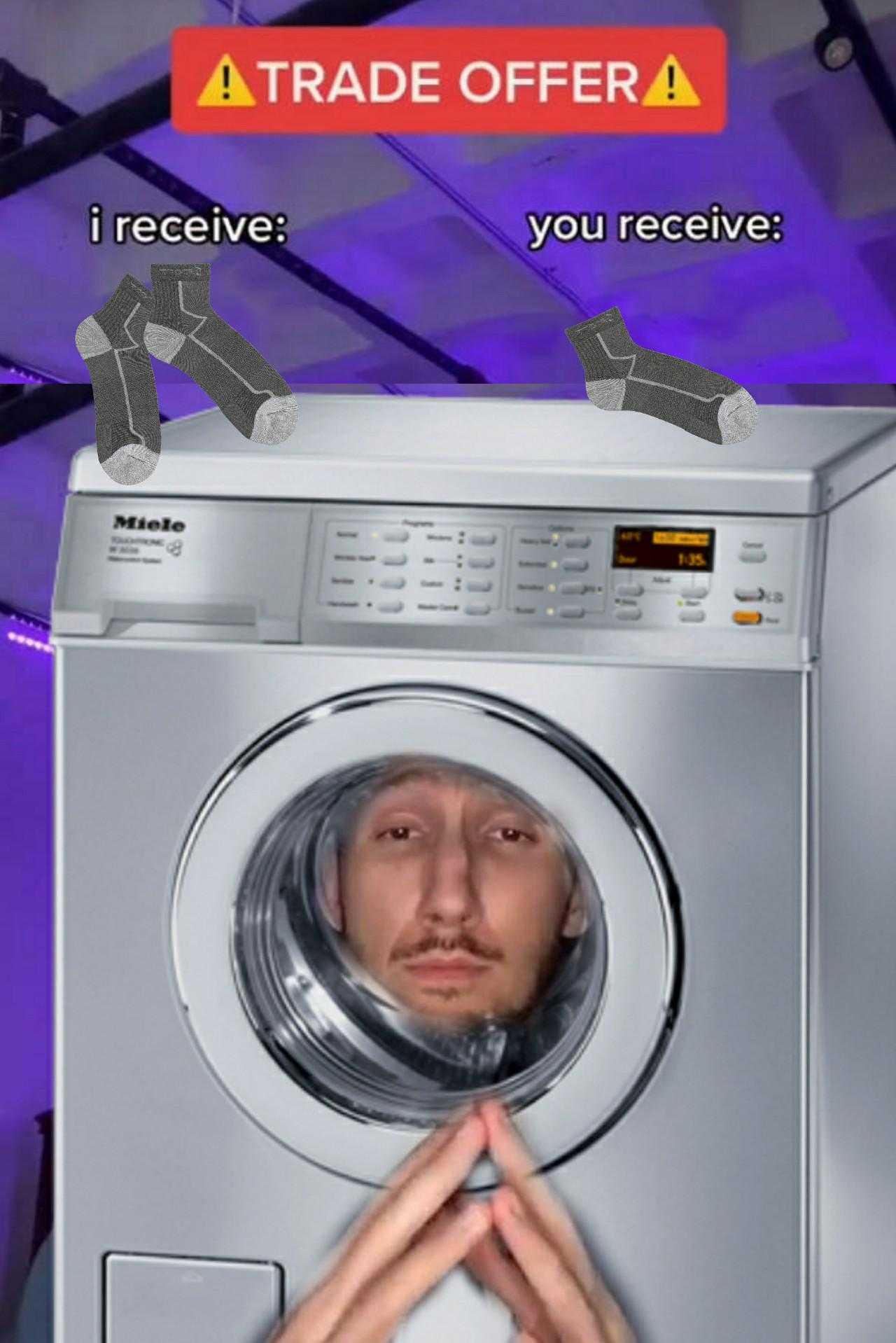 someone is trying to get a washing machine out of the washing machine