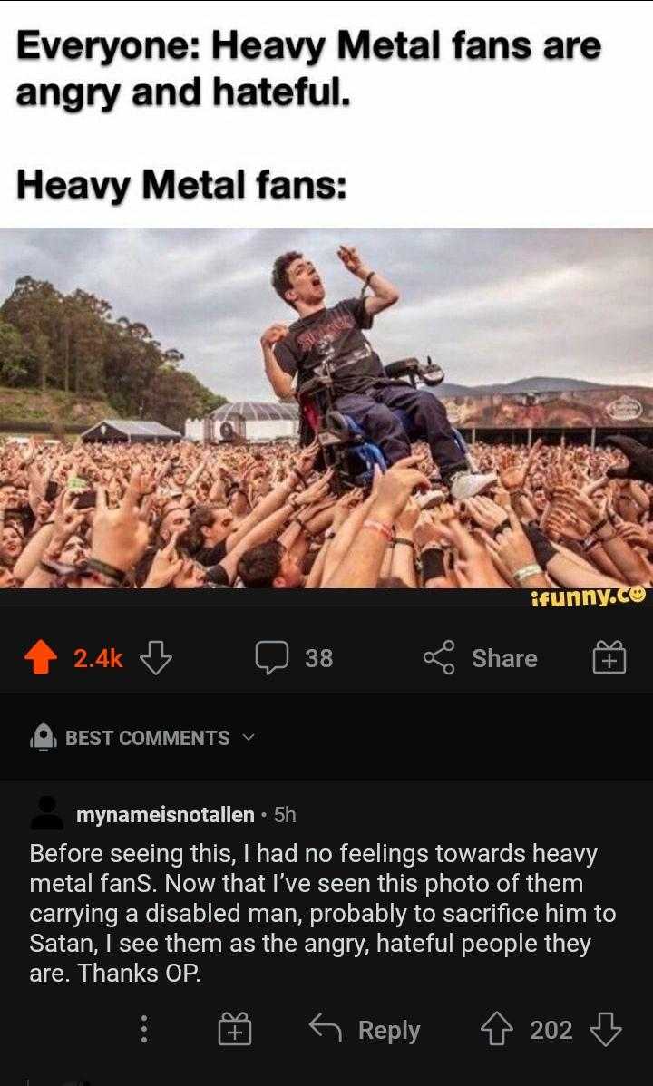 a man on a motorcycle in front of a crowd of people