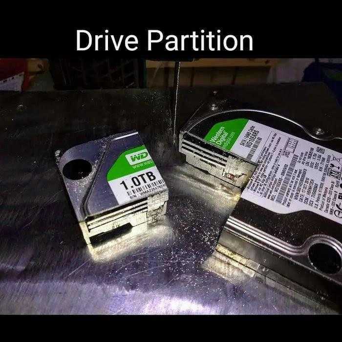 two hard drives are sitting on a table with a price tag