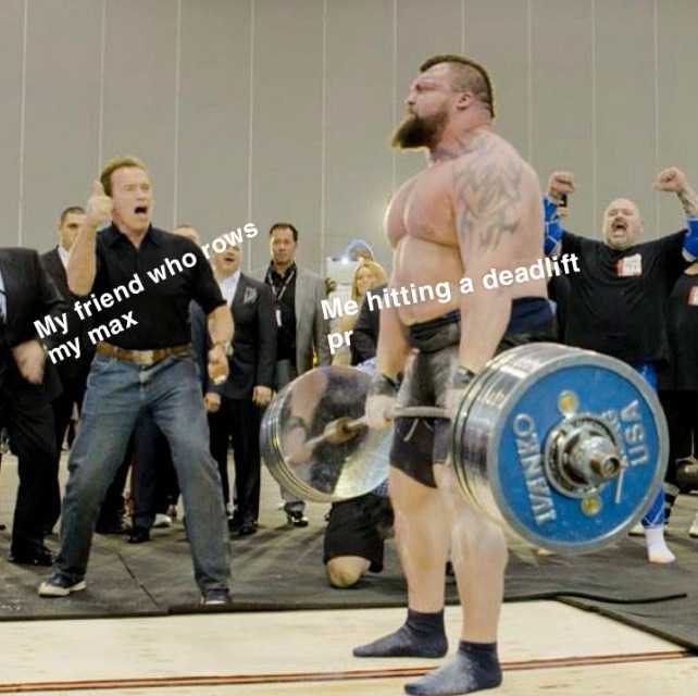 there is a man holding a barbell in front of a crowd