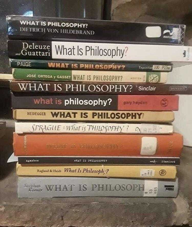 a close up of a stack of books on a table