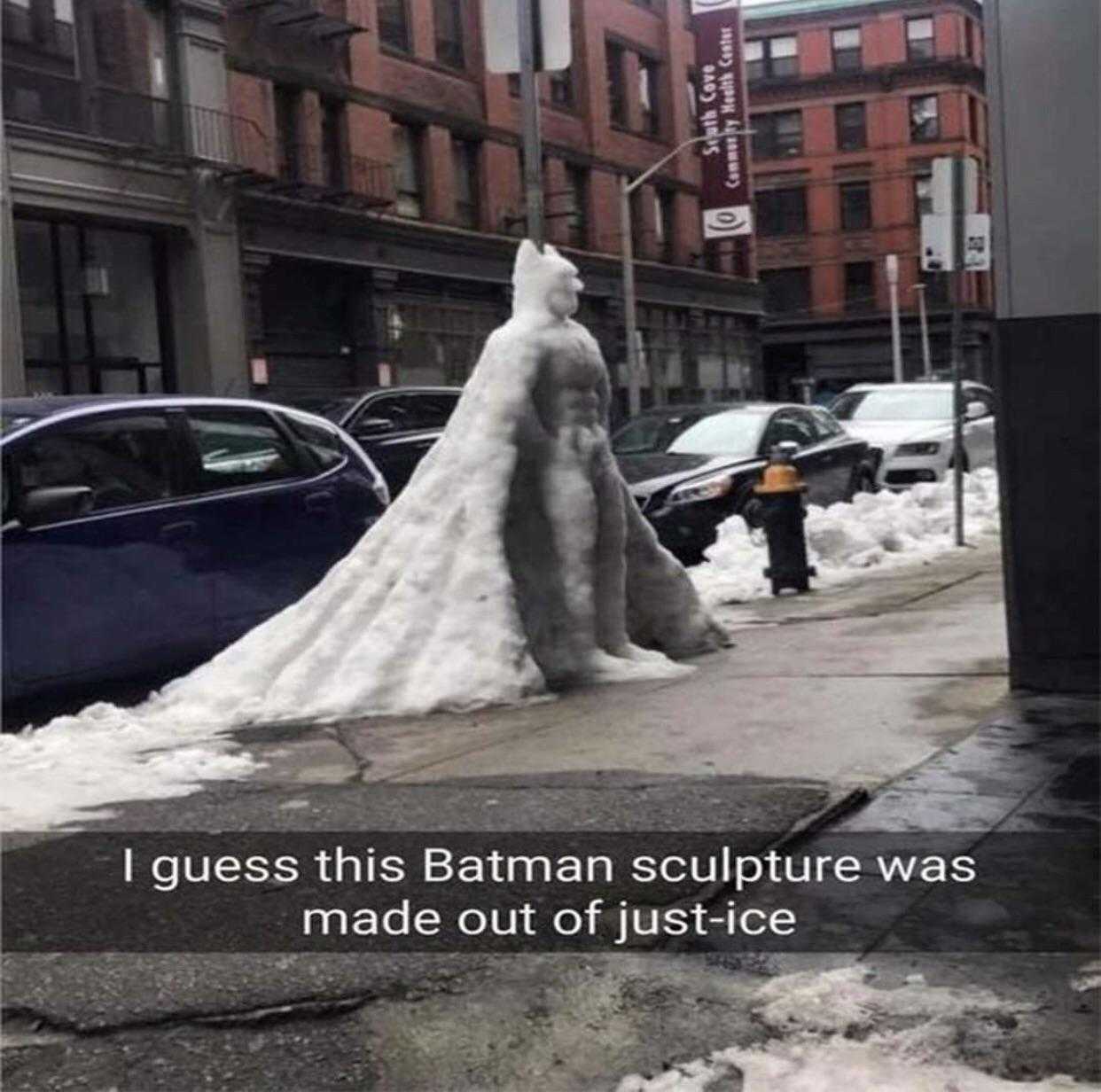 batman sculpture made out of ice on a city street