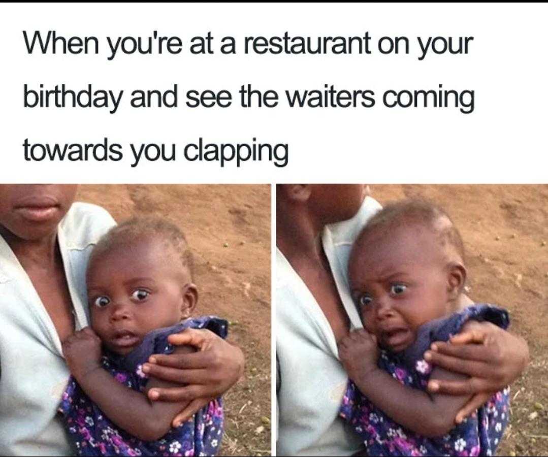 woman holding a baby in her arms and a caption that reads when you ' re at a restaurant on your birthday and see the waiters coming towardss clapping