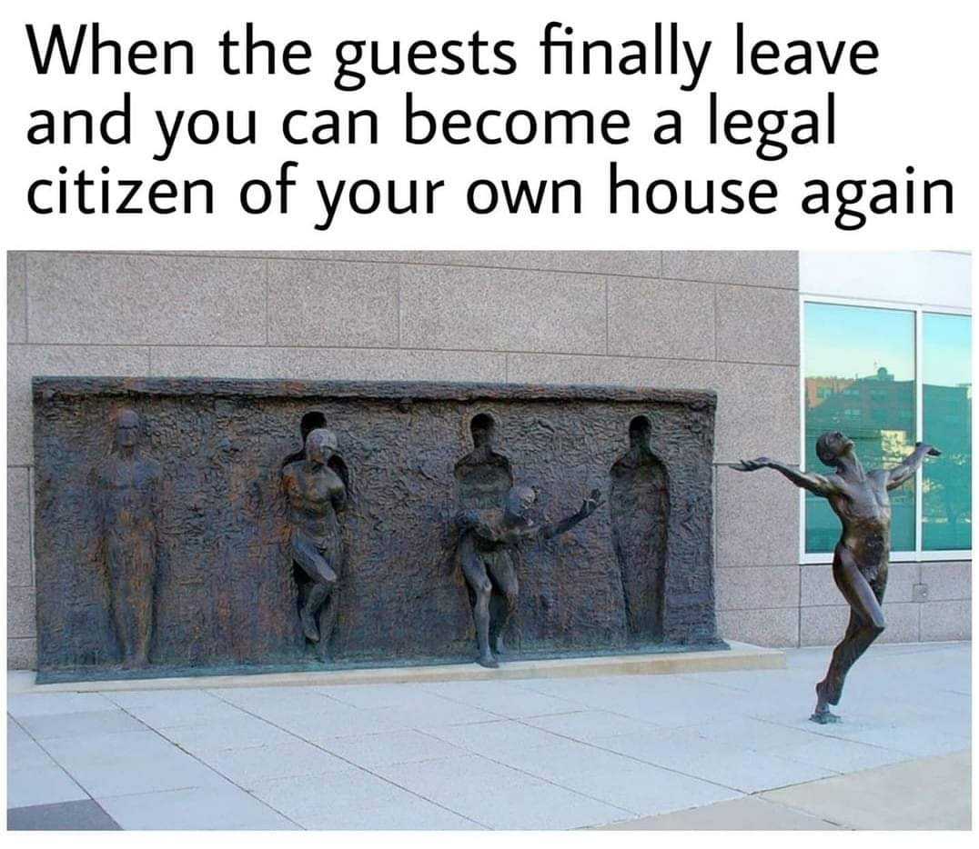 there are three statues of people on a wall with a caption