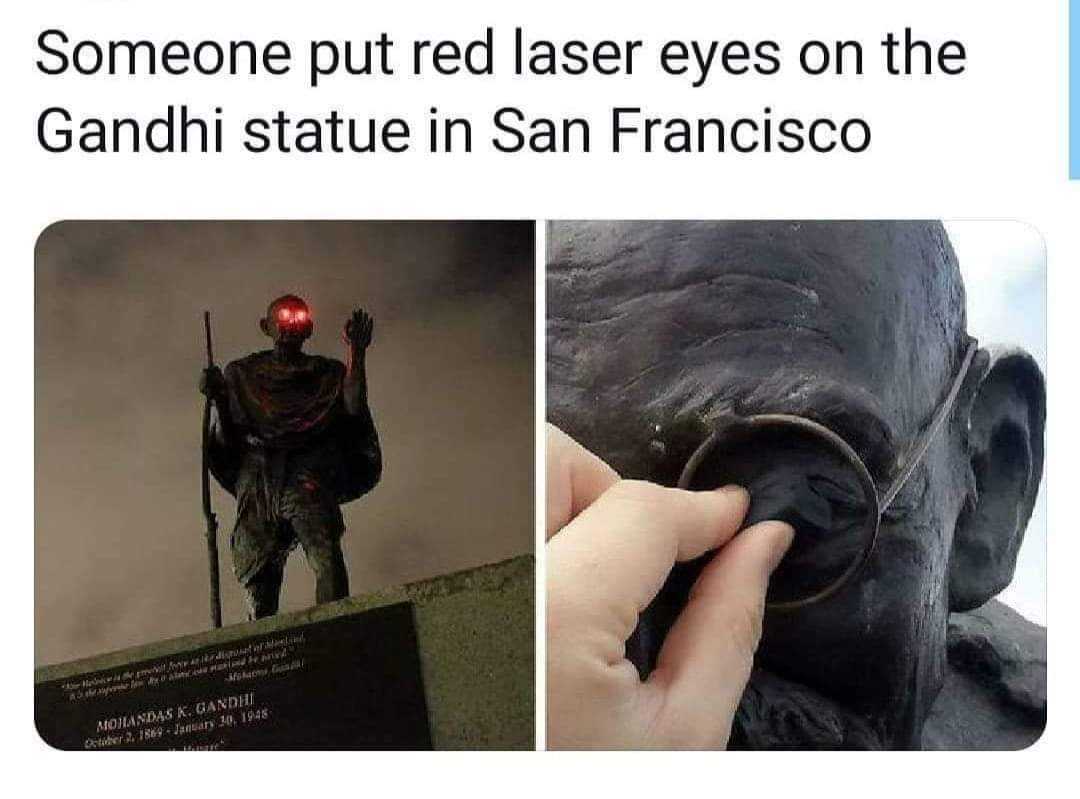 image of a statue of a man with a red light on his eye