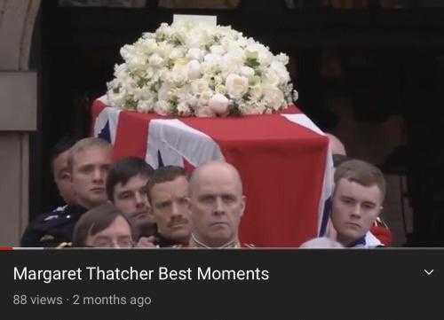 image of a man in uniform carrying a casket