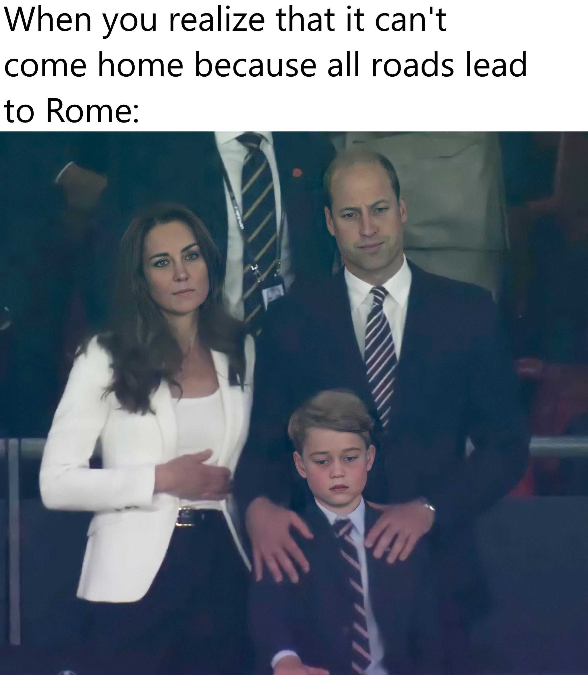 image of a man and woman and a boy in suits