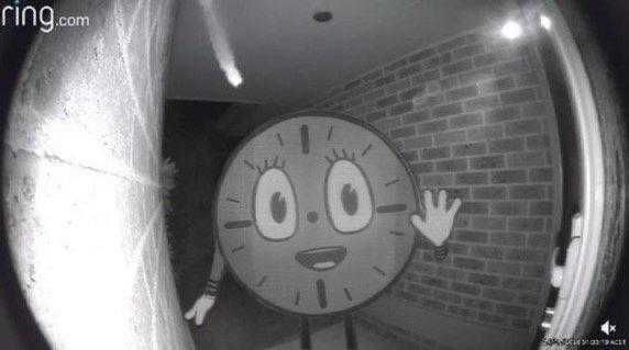 a close up of a clock with a face and hands in a room