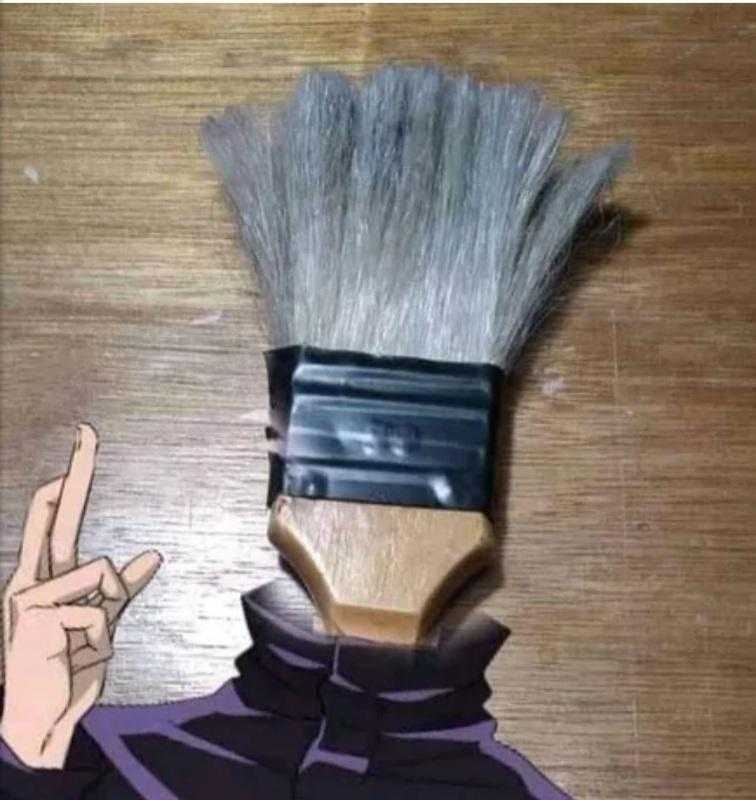 a close up of a person with a brush on their head