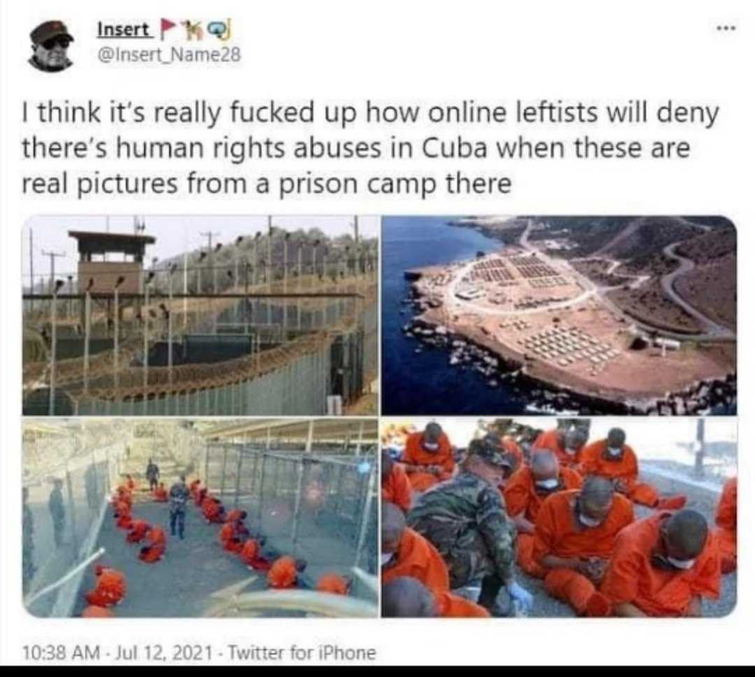 a group of people in orange prison uniforms sitting on a boat