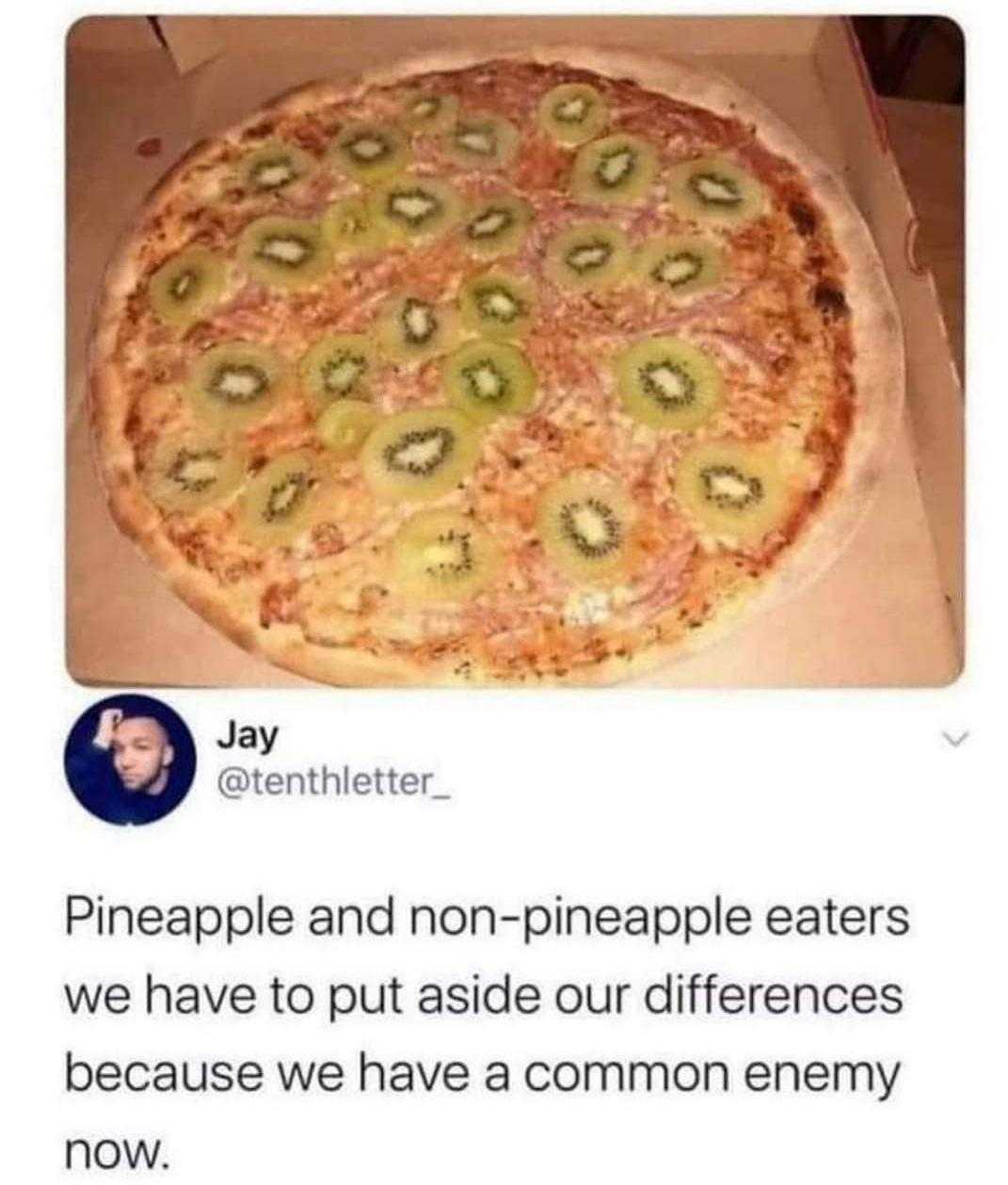 a close up of a pizza in a box with a person on it