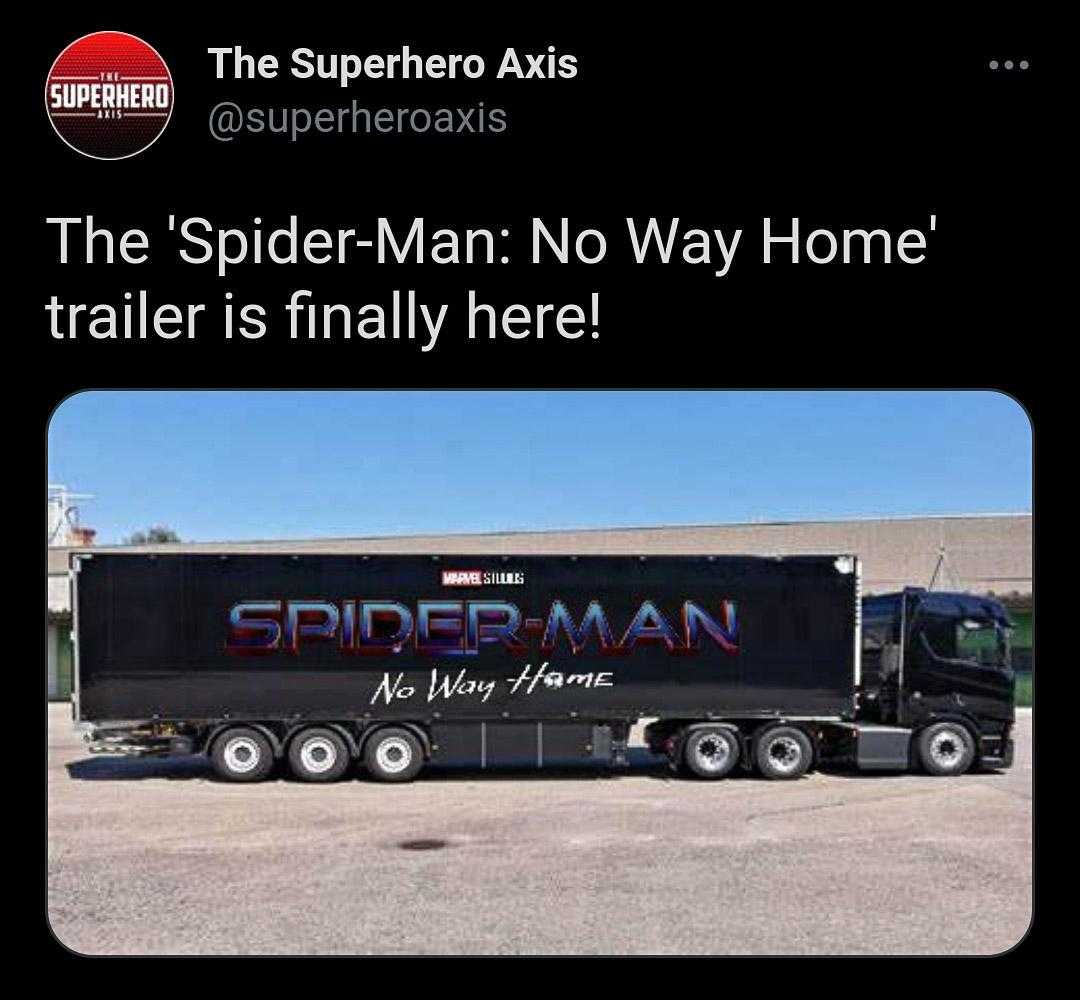 a close up of a semi truck with a spider - man trailer on the back