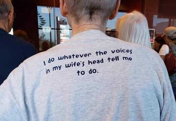 there is a man with a t - shirt that says do whatever the voice in my wife ' s head tell me to do