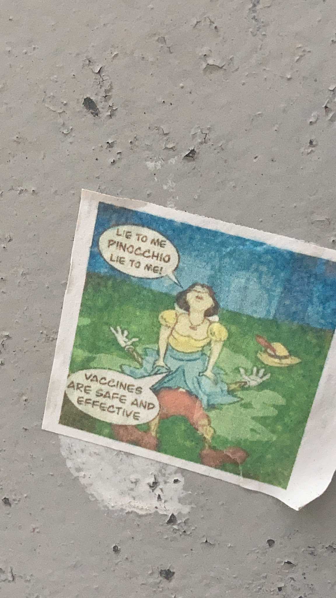 there is a sticker with a cartoon of a woman sitting on a rock