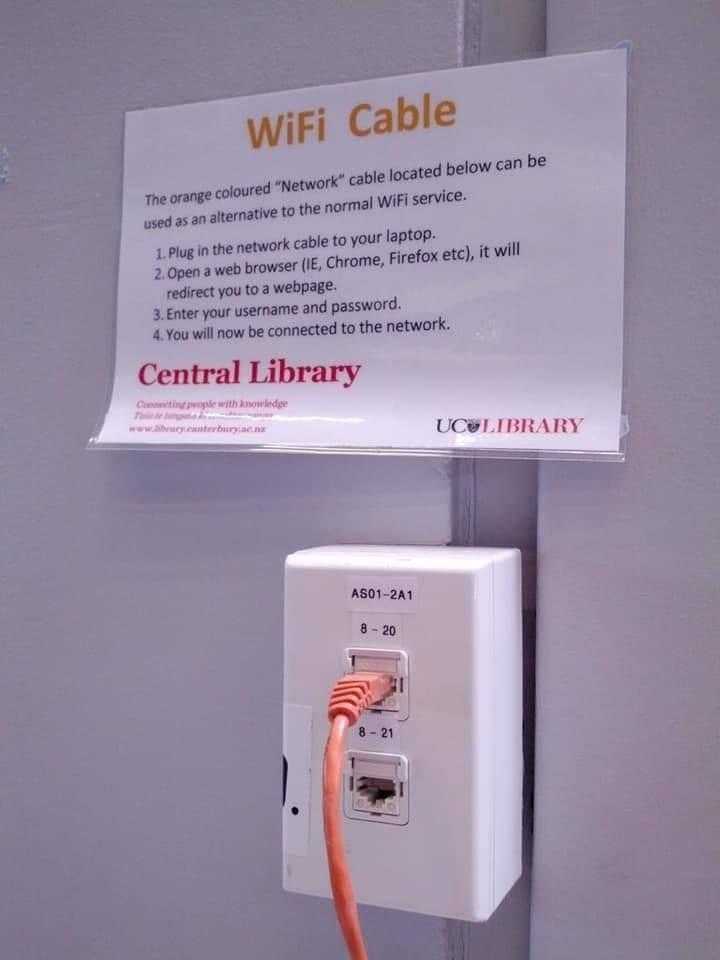 there is a sign on the wall that says wifi cable