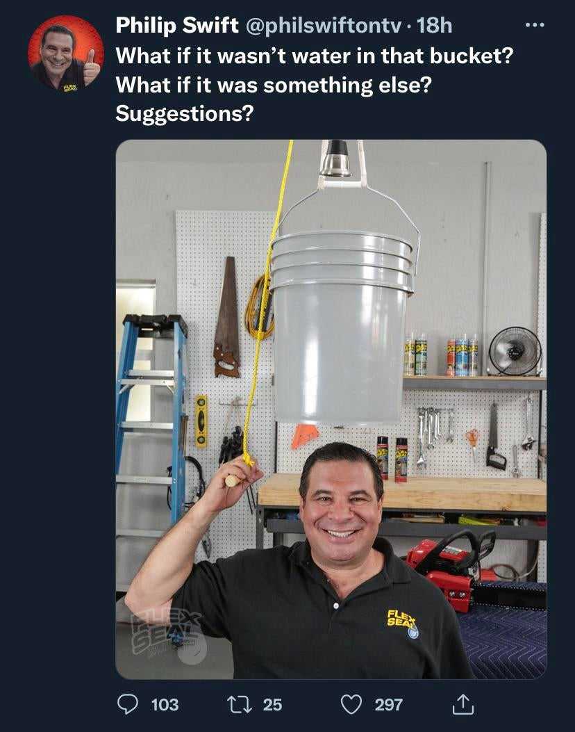 man holding a bucket with a water hose attached to it