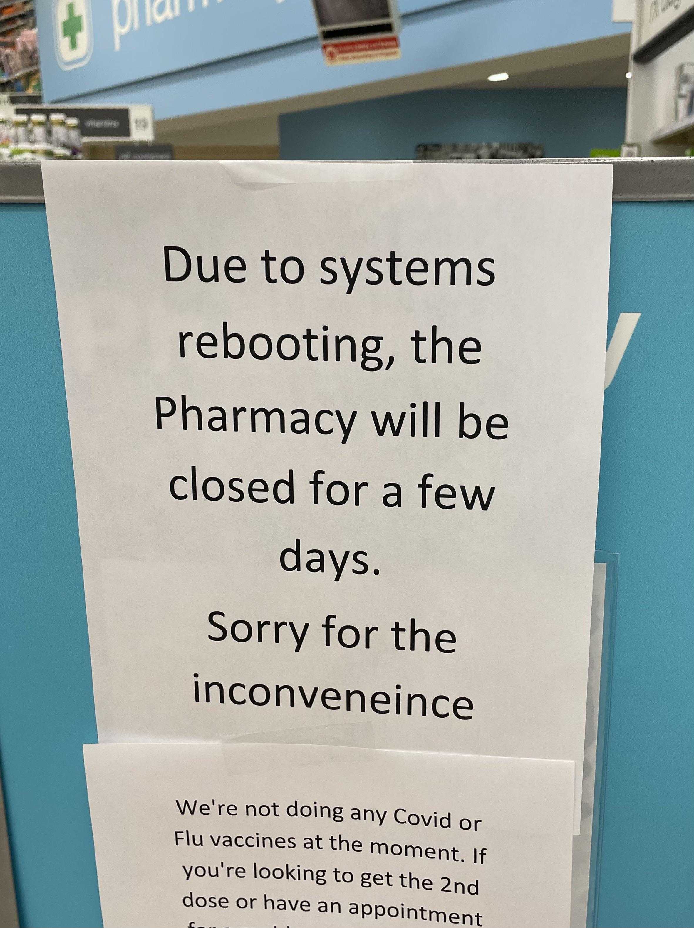 sign on a pharmacy door stating customers to not use the inconvenience