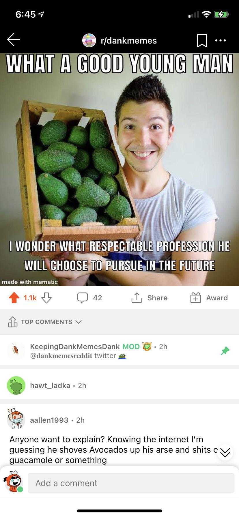 a close up of a person holding a box of cucumbers