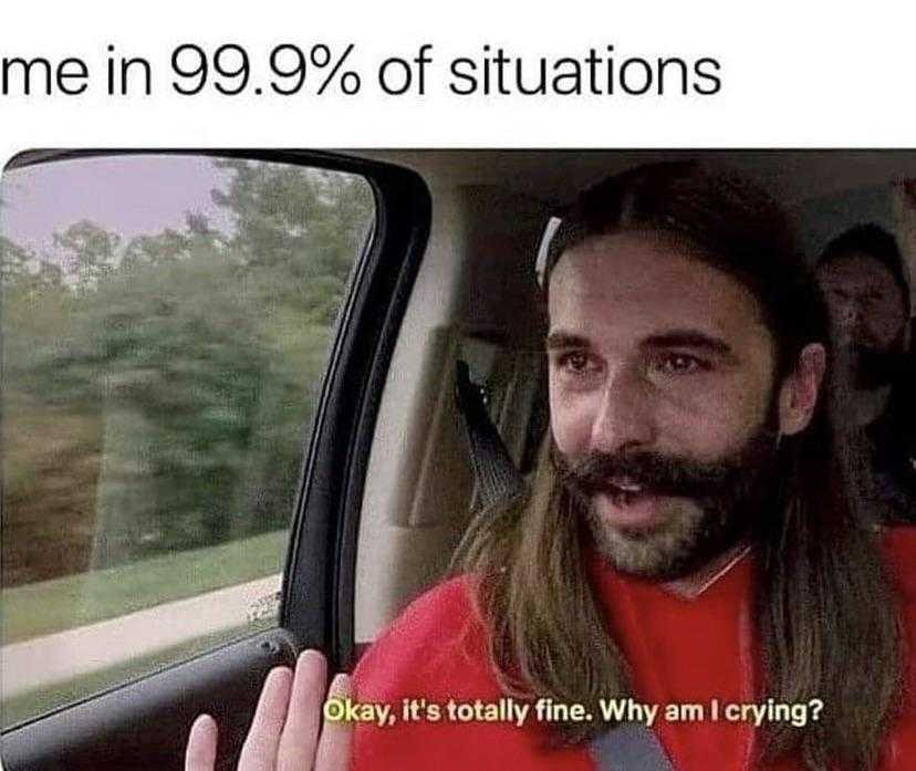 man in a car with a beard and a red shirt