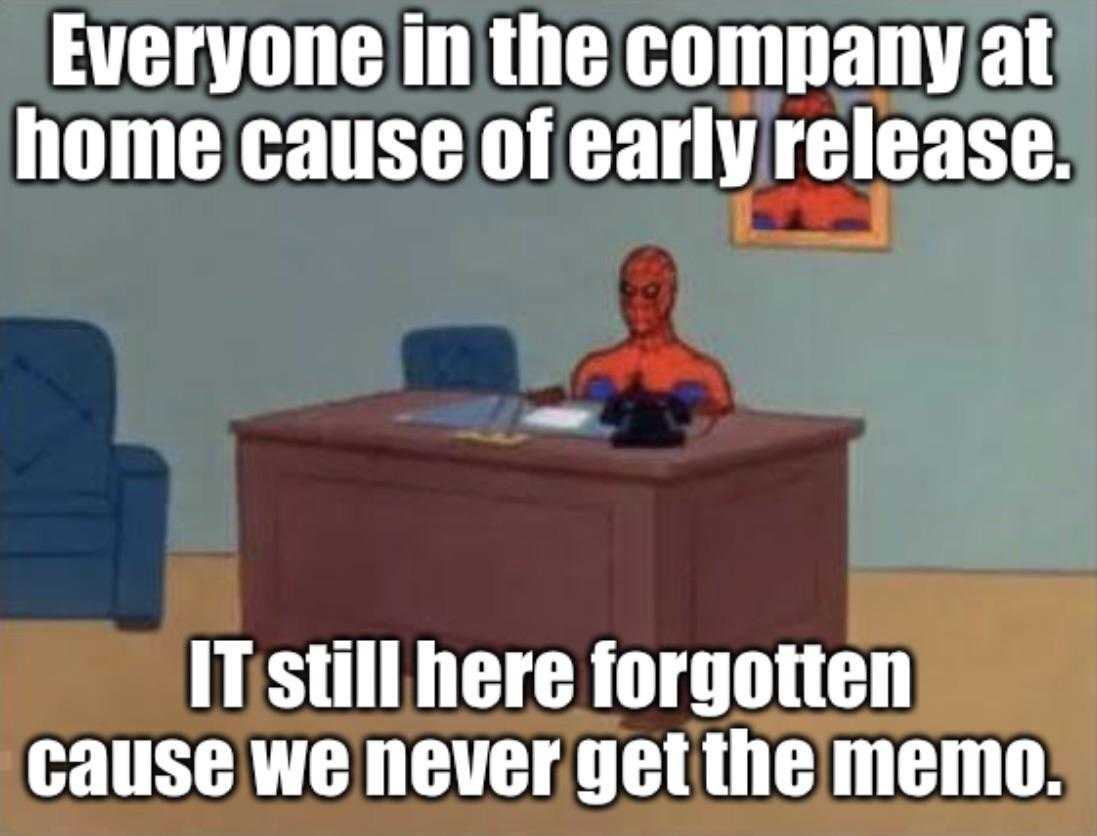 a cartoon spider man sitting at a desk with a computer