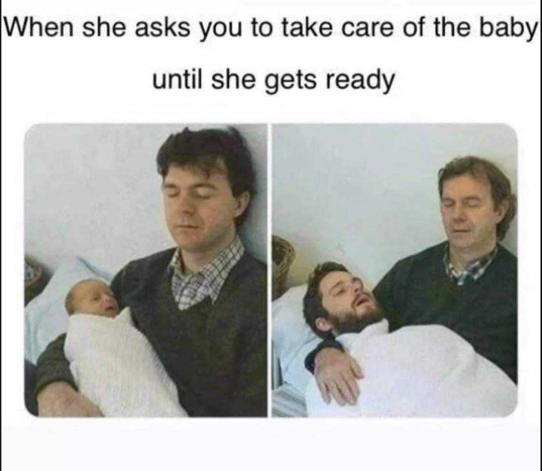 man holding a baby in bed with a caption of a man holding a baby