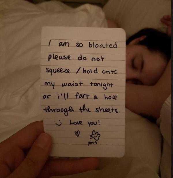 someone is holding a note with a handwritten poem on it