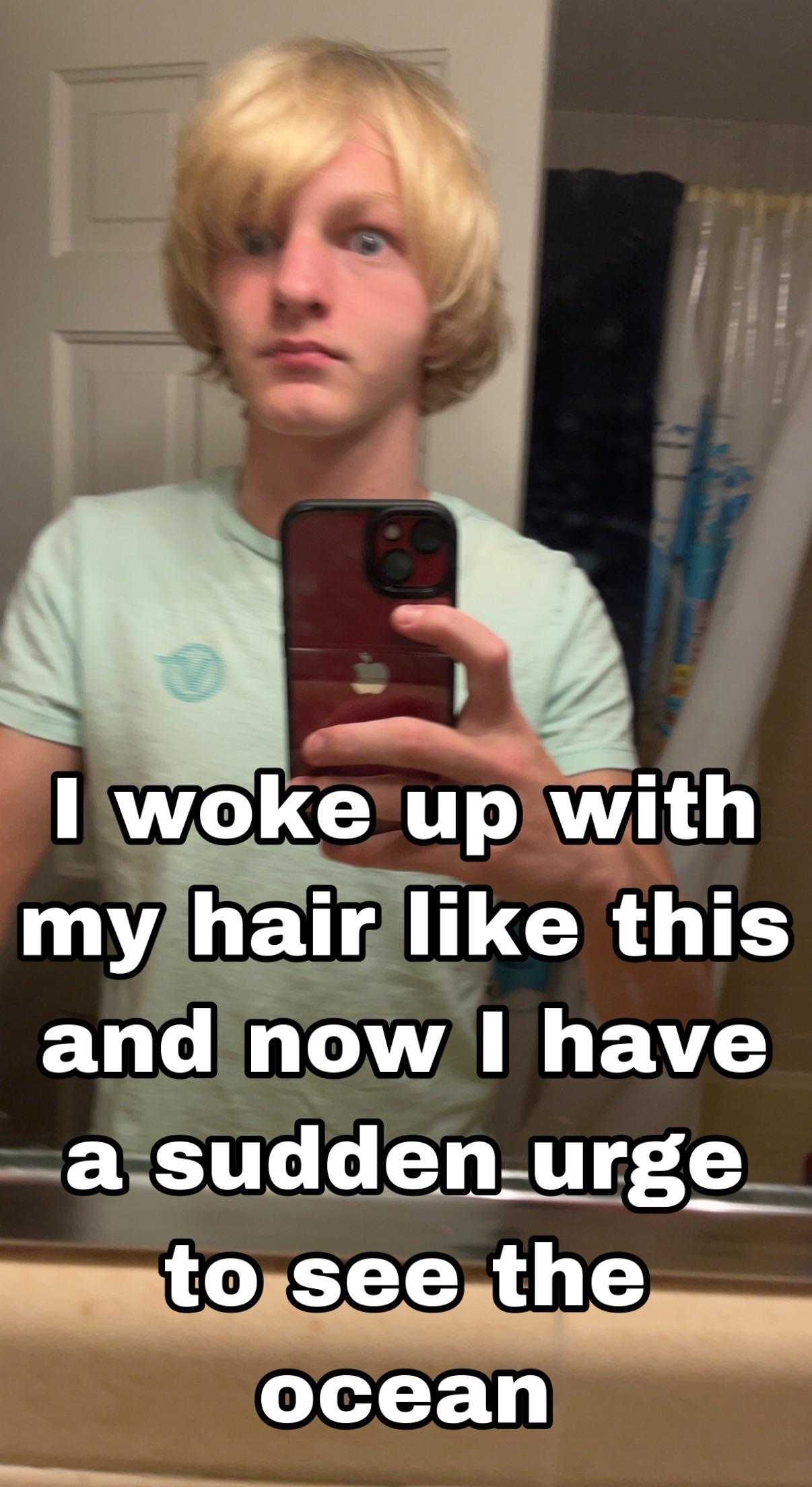 man taking a selfie in a bathroom mirror with a caption of a quote