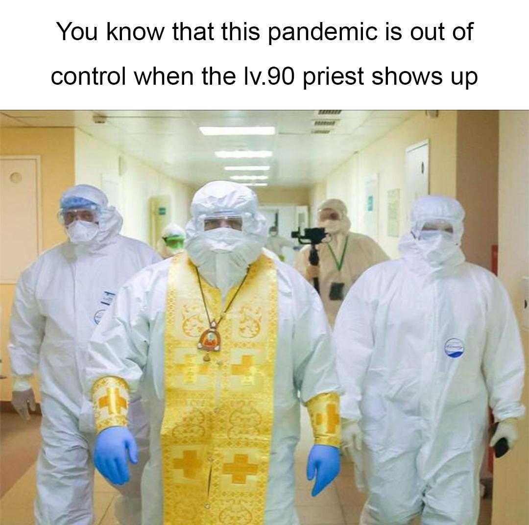 three people in protective gear walking down a hallway with a priest