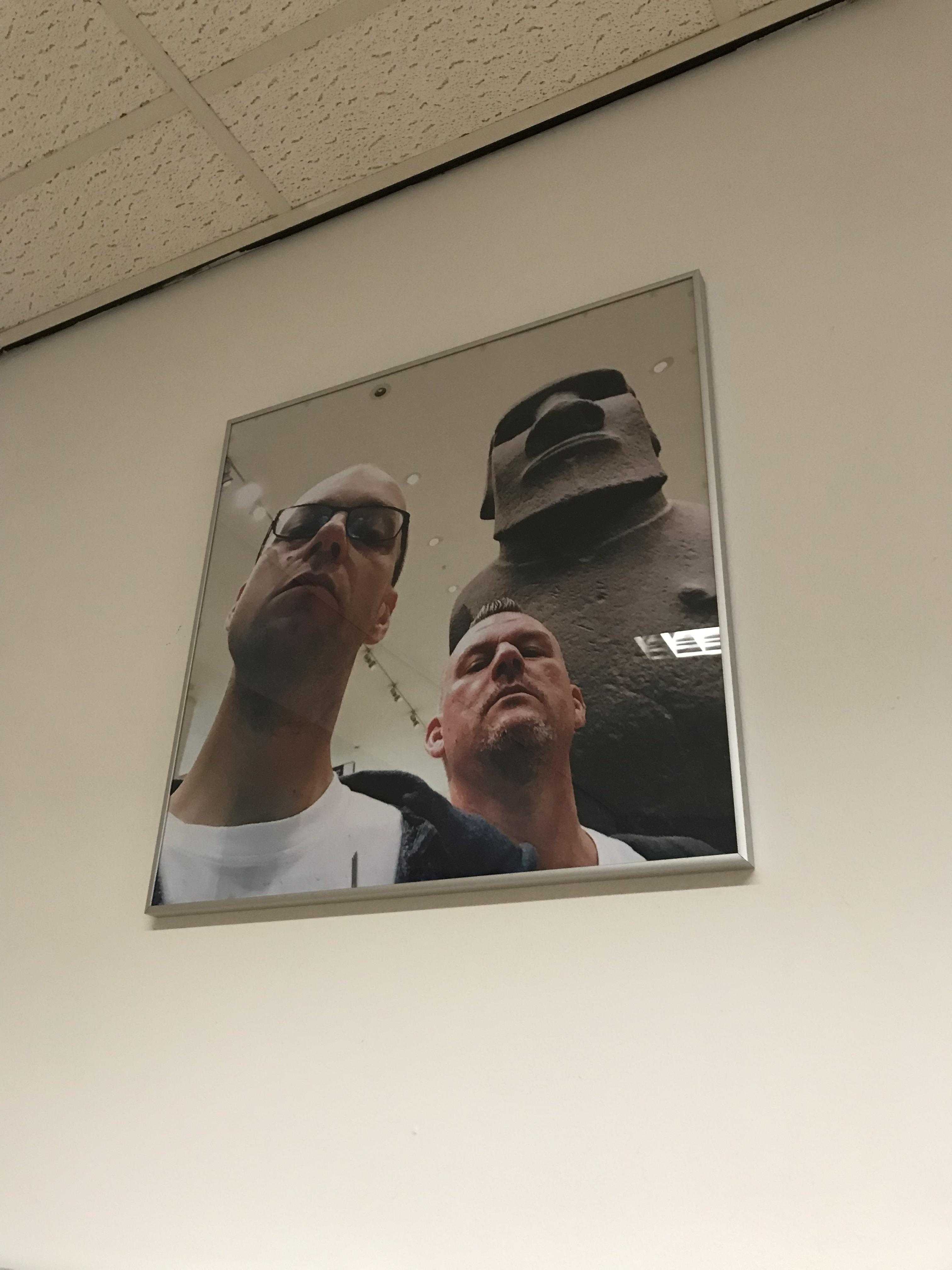 there is a picture of two men hanging on the wall