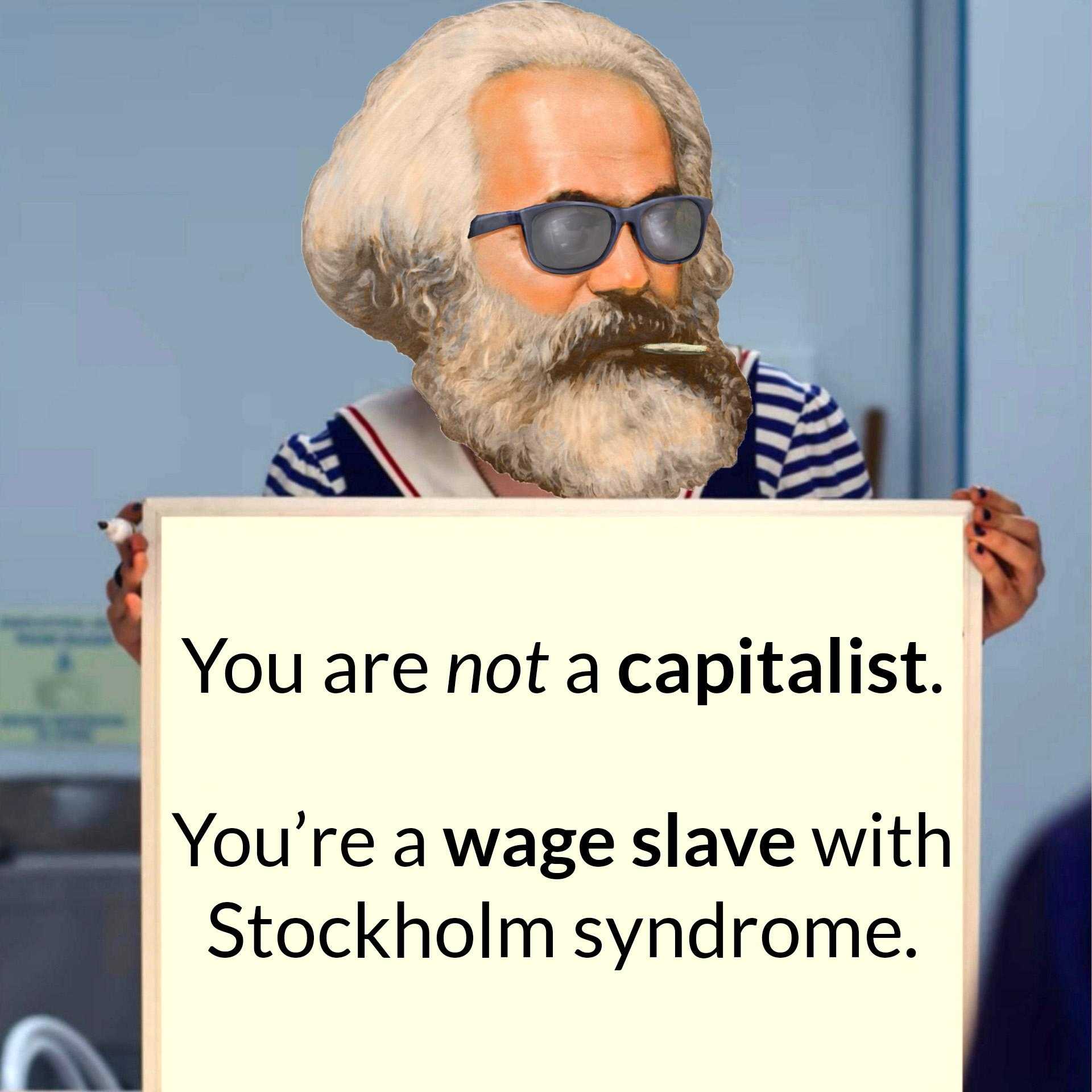 there is a man with a beard and sunglasses holding a sign