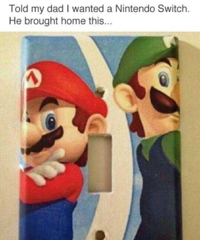 a close up of a light switch cover with a mario and luigi