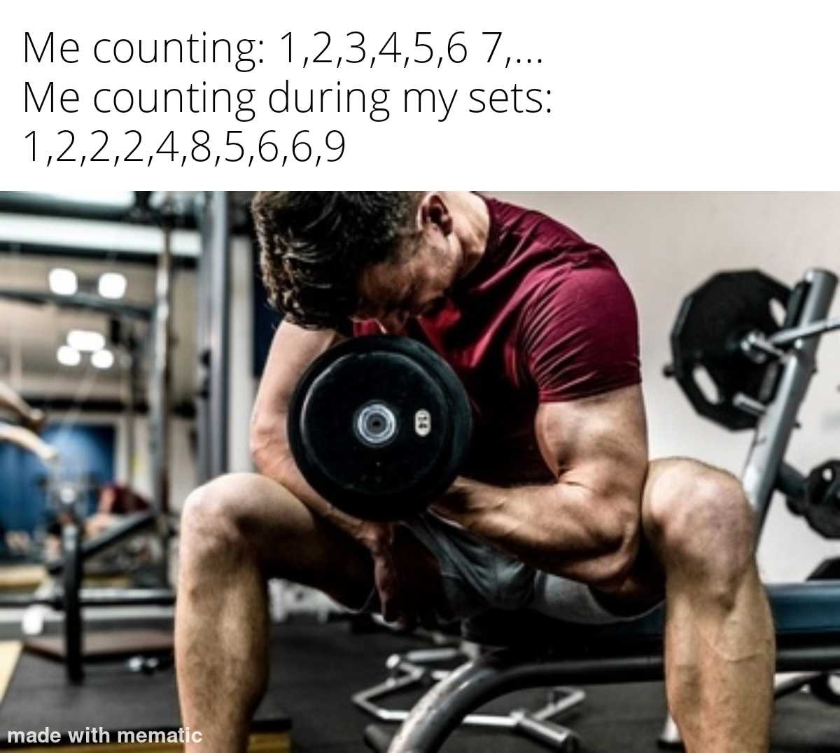 man squatting with dumbs in a gym