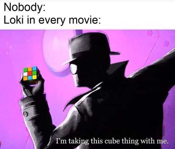 image of a man in a hat holding a rubik cube