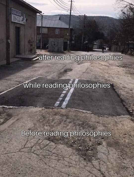 image of a street with a building and a sign that reads after reading philosophers while reading philosophers before reading philosophiosphers