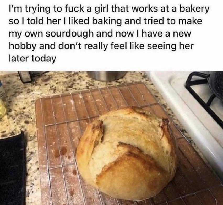 loaf of bread on a cooling rack on a kitchen counter