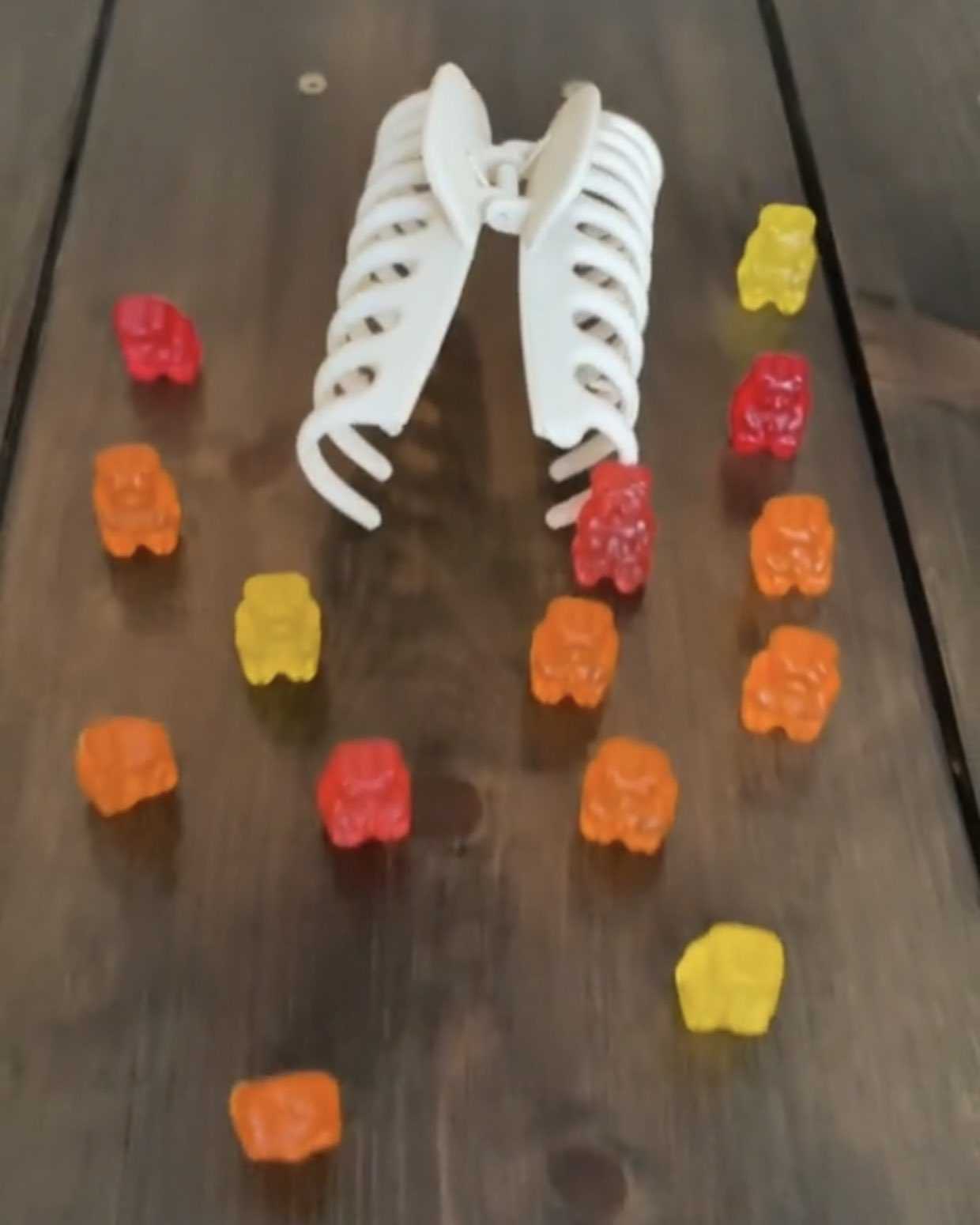 there are gummy bears on the table with a pair of shoes