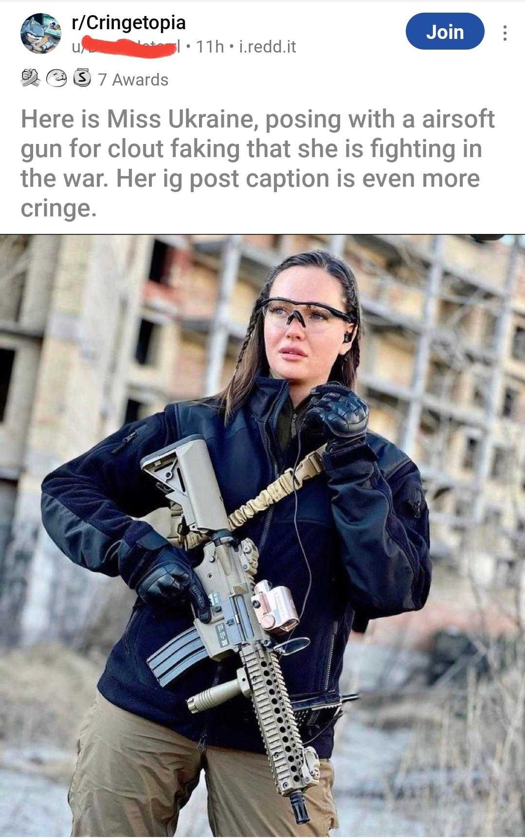 woman holding a gun and wearing glasses