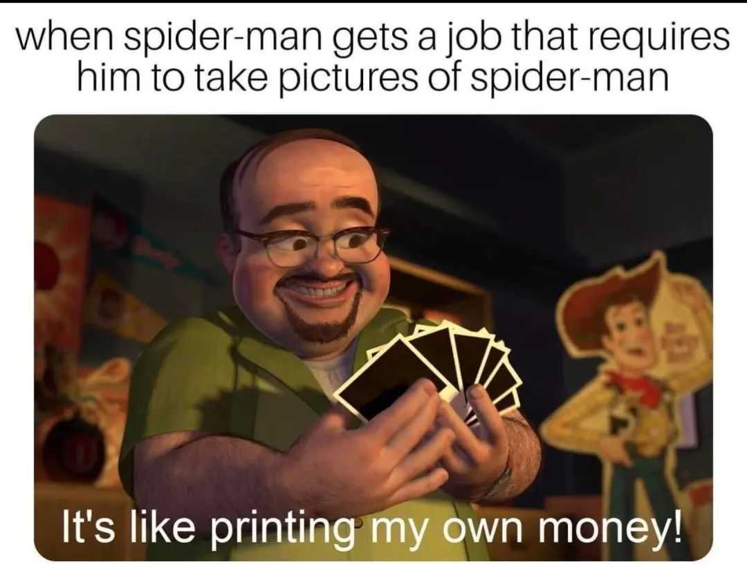 man holding playing cards in front of a picture of a spider