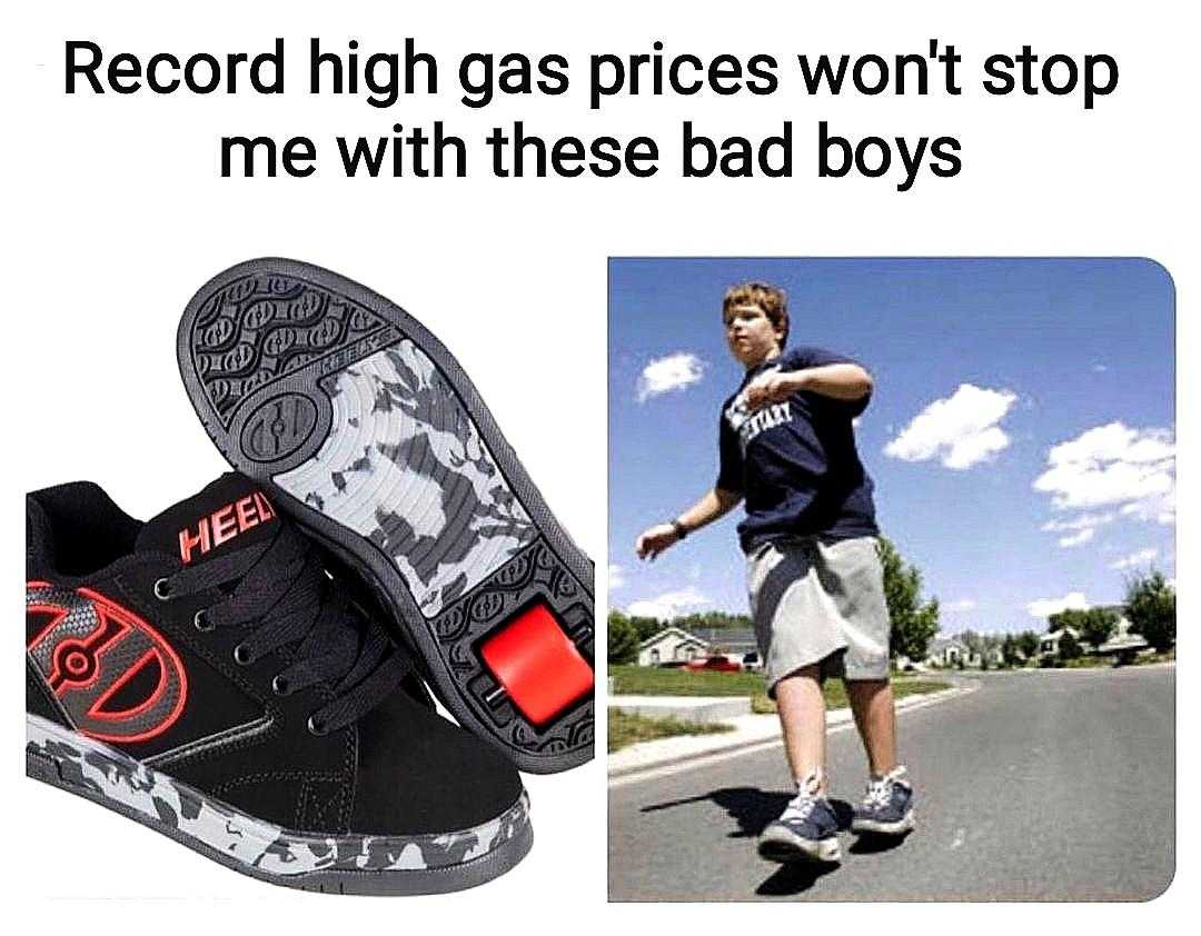 image of a man riding a skateboard on a road