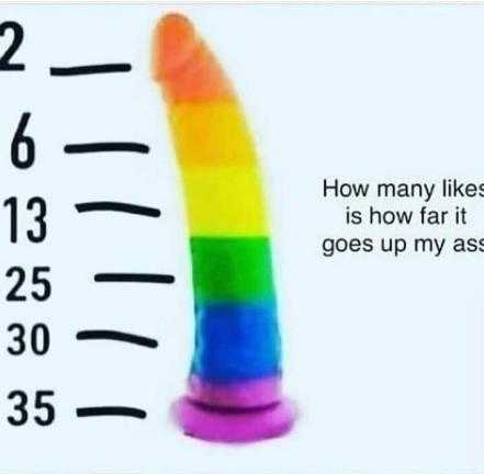 a close up of a rainbow colored plastic toy with a height scale