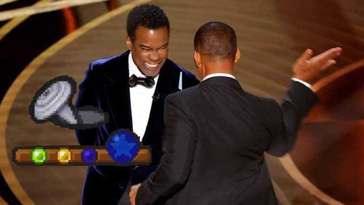 two men in tuxedos are shaking hands at an oscars