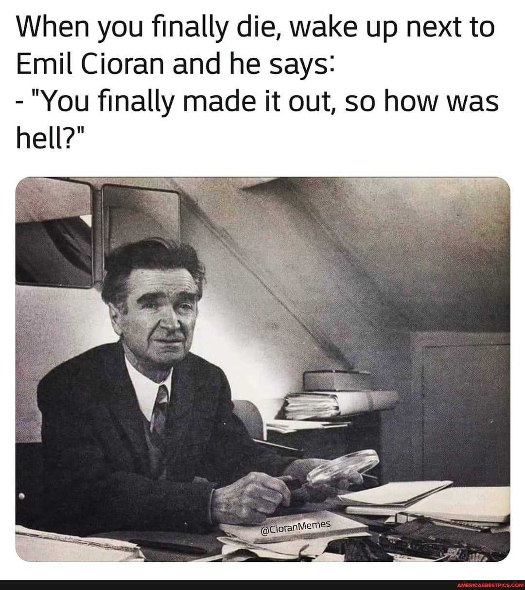 picture of a man sitting at a desk with a book