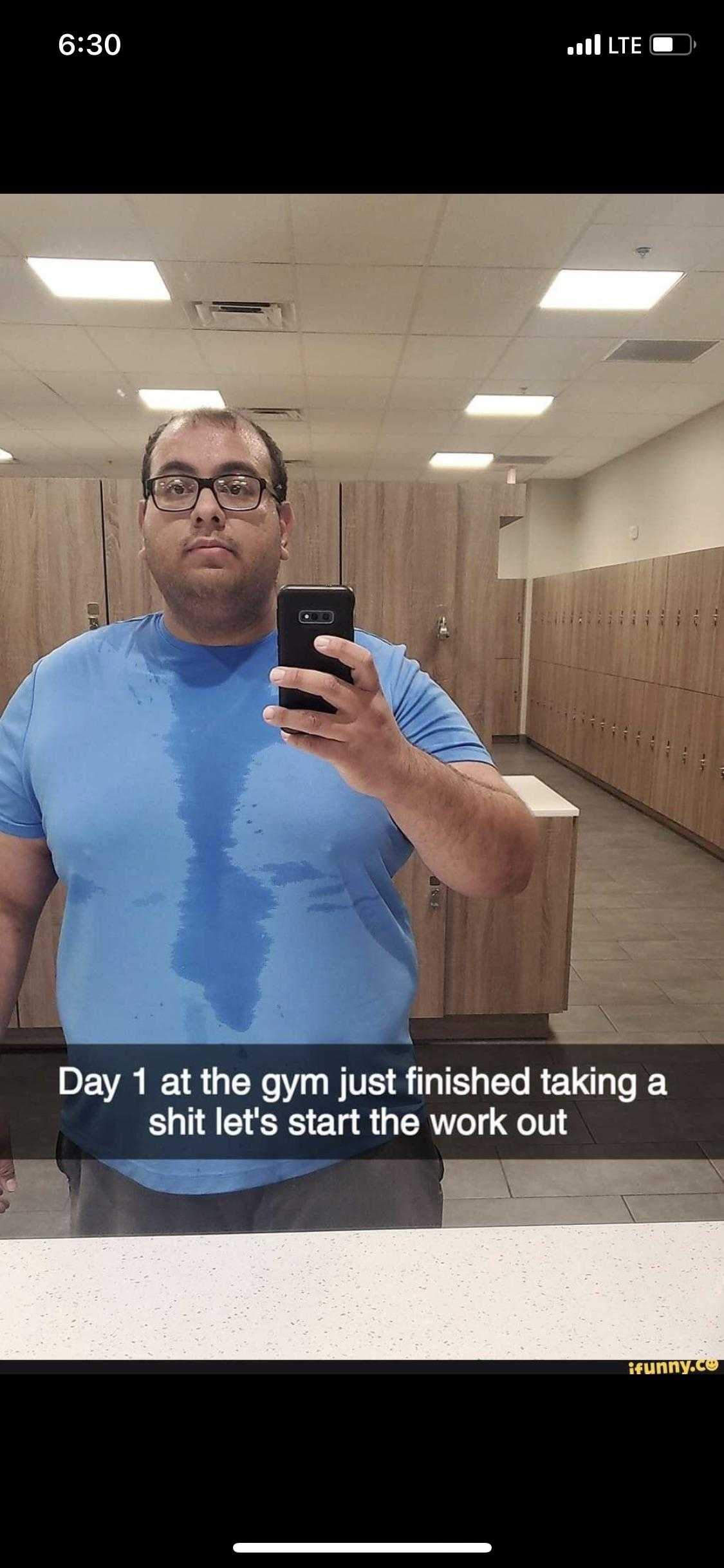 there is a man taking a selfie in a gym room