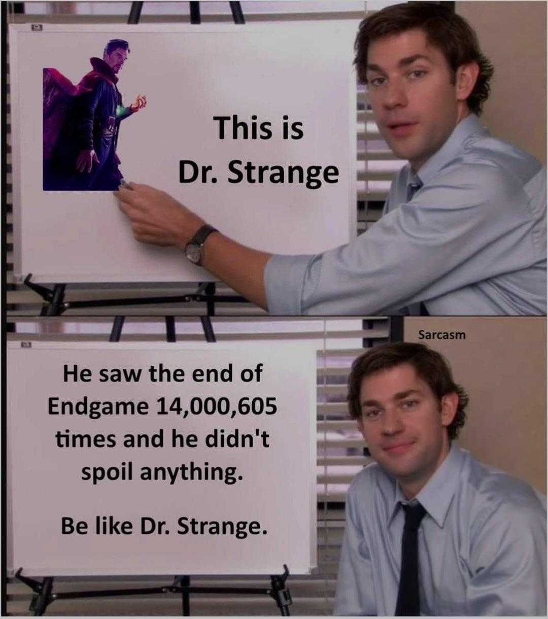 image of a man holding a sign with a picture of dr strange