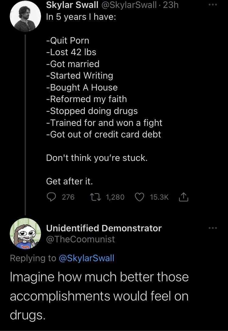 a screenshot of a twitter post with a picture of a man on a cell phone