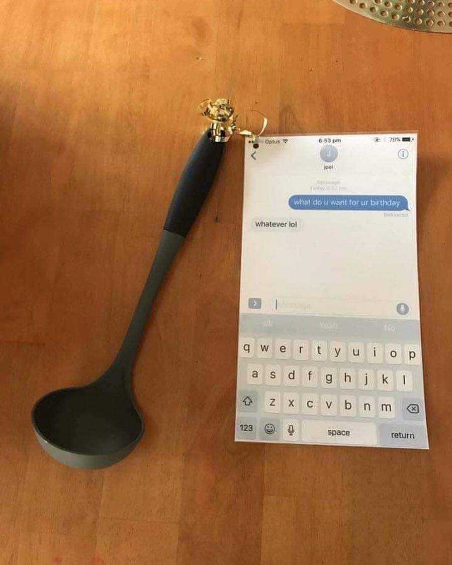 there is a spoon and a paper on a table