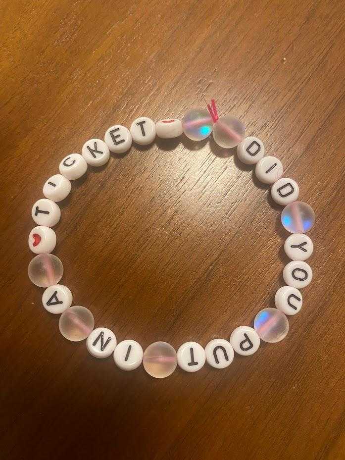 there is a bracelet with a bead that says sweet