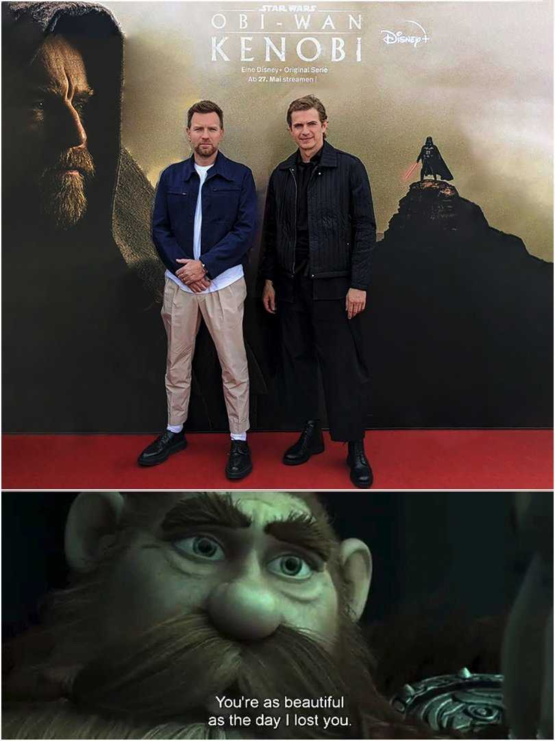 image of two men standing next to a poster of a movie